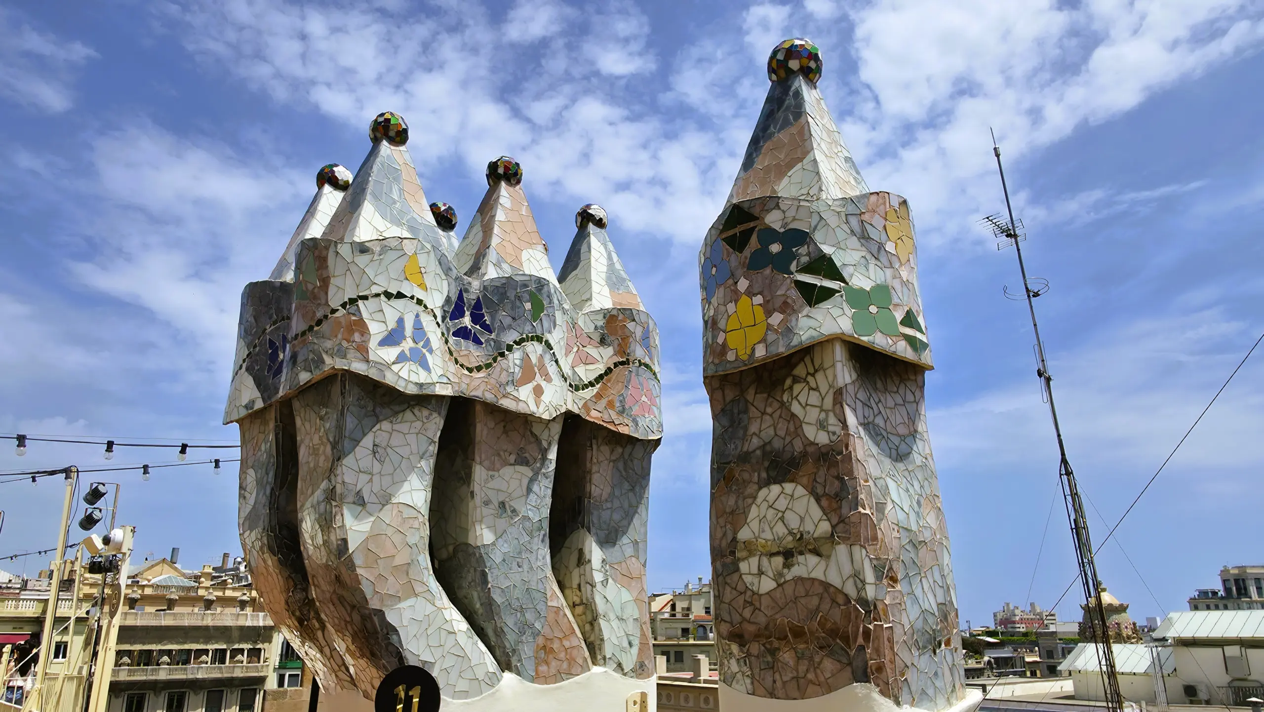 Mosaic chimneys on the rooftop of Casa Batlló in Barcelona, a signature element of Antoni Gaudí’s colorful architectural style