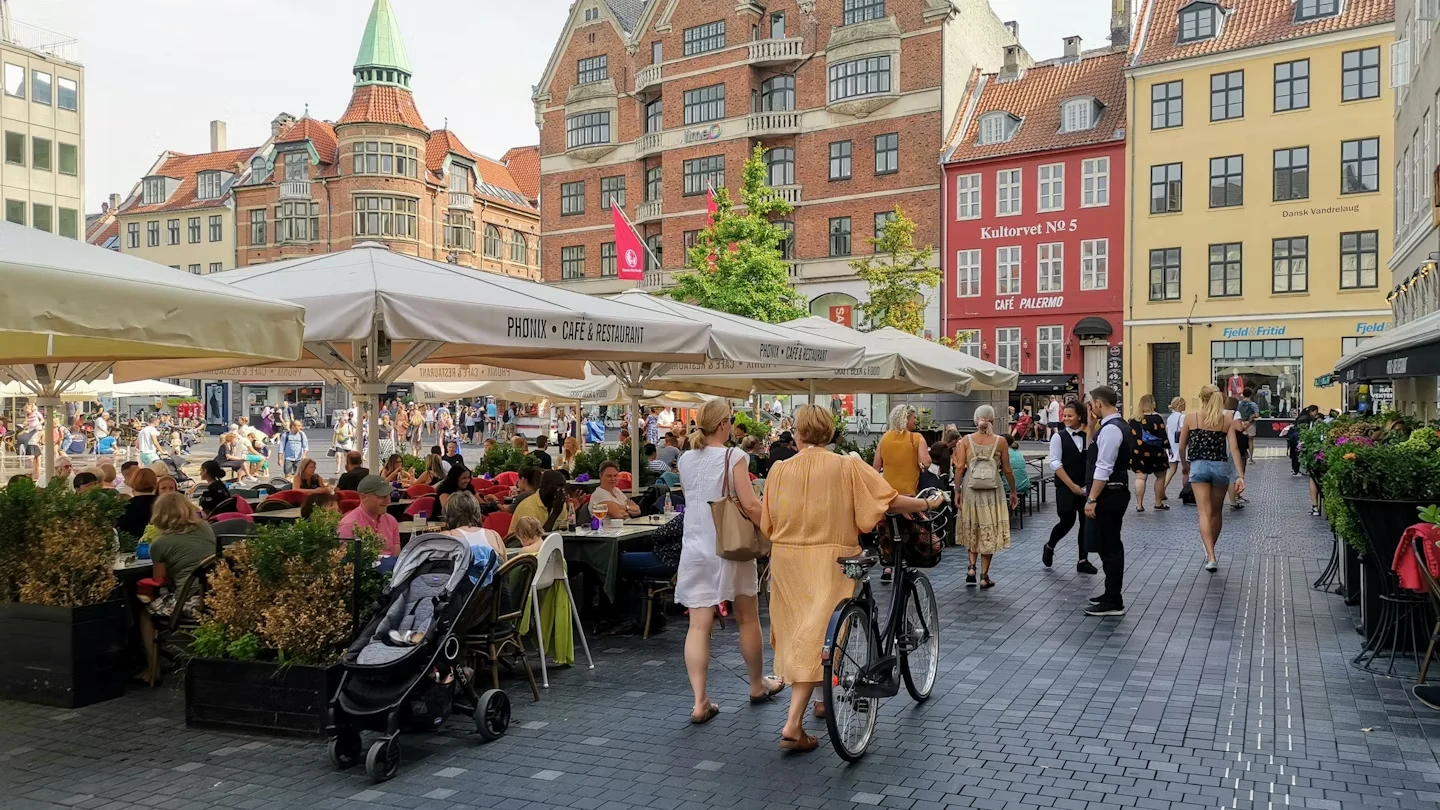 Copenhagen streets with outdoor restaurant furniture.