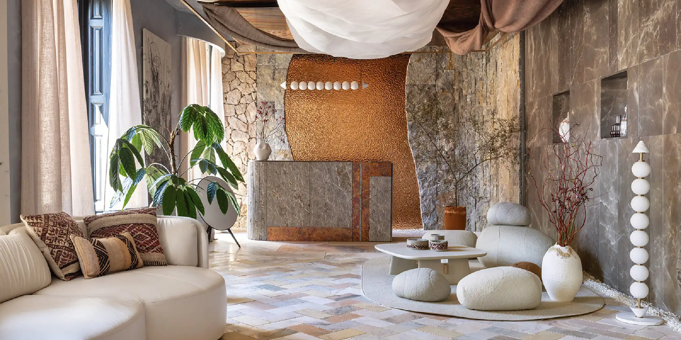 Contemporary artisan interior design lobby featuring Ibiza stone, handcrafted architectural surfaces, natural textures, and luxury craftsmanship blending tradition and modern design.