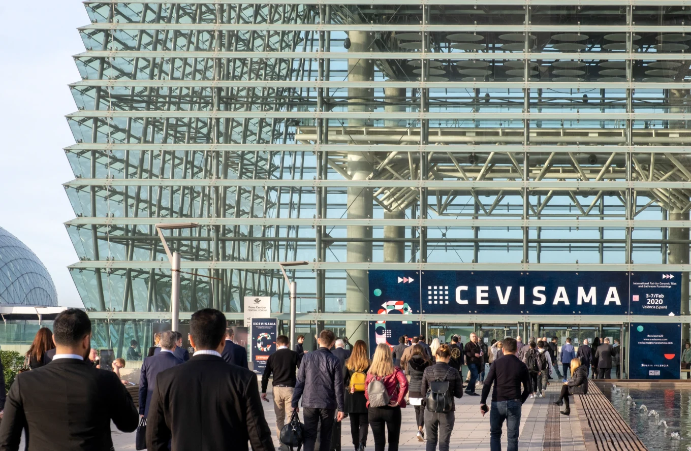 Visitors approaching the glass-fronted entrance of Feria Valencia beneath the Cevisama 2020 banner.