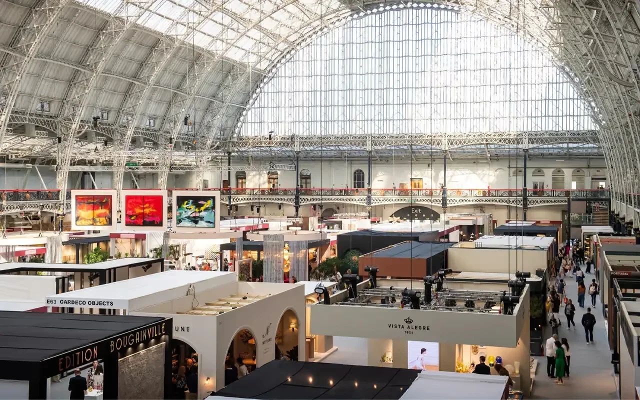 A view of Decorex at Olympia London, showing curated interior design stands featuring contemporary furniture, lighting, textiles, and decorative objects presented by international luxury brands during the 2025 edition of the fair.